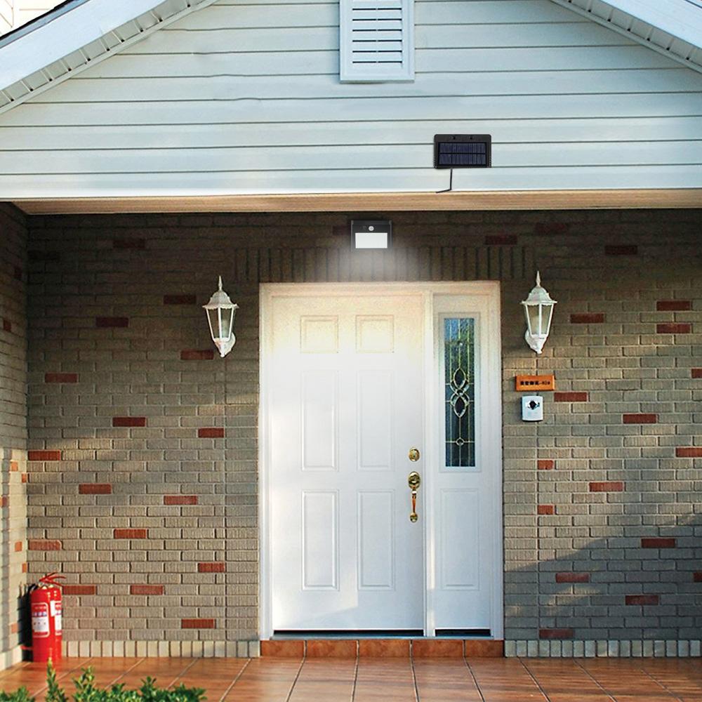Solar wall light in front of the door